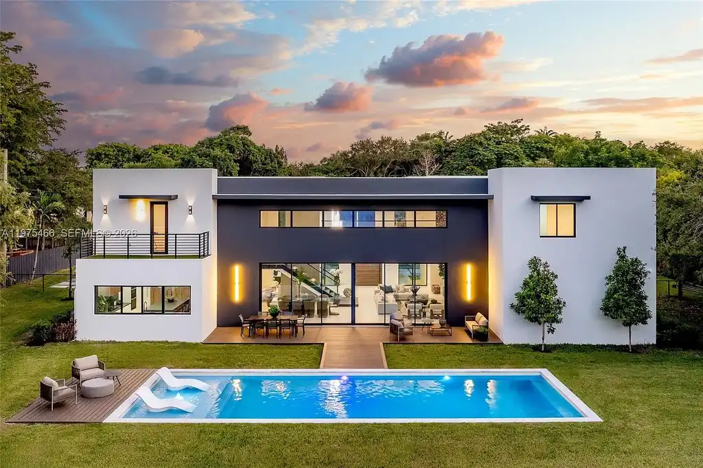$10.4 Million Spectacular Modern Estate Redefining Luxury Living in Prime Pinecrest Real Estate 16 Chef’s kitchen with premium appliances and oversized island at 6445 SW 129th Ter Pinecrest