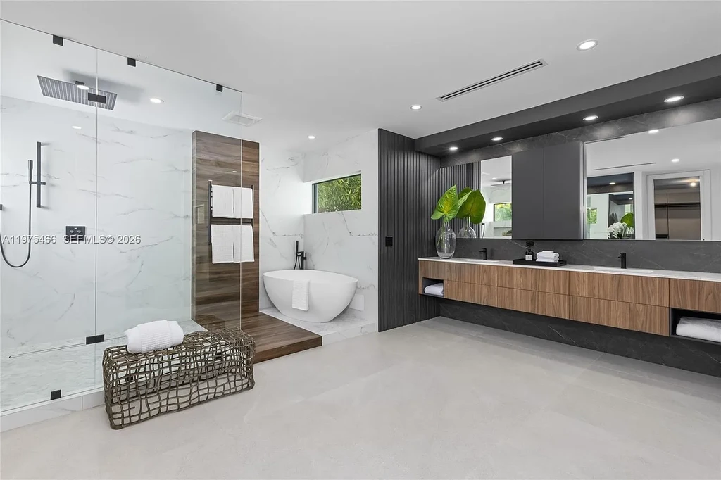 $10.4 Million Spectacular Modern Estate Redefining Luxury Living in Prime Pinecrest Real Estate 14 Chef’s kitchen with premium appliances and oversized island at 6445 SW 129th Ter Pinecrest