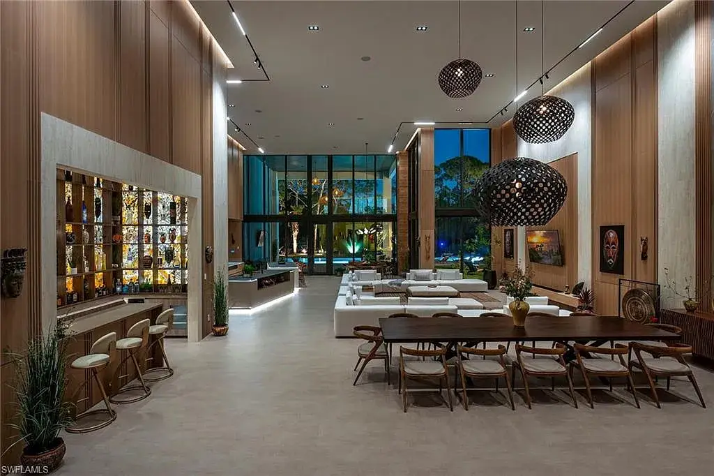 $14.5 Million Stunning Resort-Style Masterpiece in Naples Real Estate Showcases Breathtaking Modern Luxury Living 7 6616 Trail BLVD Naples luxury home with modern architecture, infinity pool, lakefront views, and resort-style outdoor living in Pine Ridge Estates