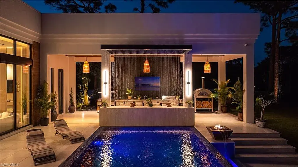 $14.5 Million Stunning Resort-Style Masterpiece in Naples Real Estate Showcases Breathtaking Modern Luxury Living 16 6616 Trail BLVD Naples luxury home with modern architecture, infinity pool, lakefront views, and resort-style outdoor living in Pine Ridge Estates