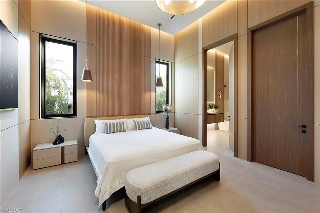 $14.5 Million Stunning Resort-Style Masterpiece in Naples Real Estate Showcases Breathtaking Modern Luxury Living 15 6616 Trail BLVD Naples luxury home with modern architecture, infinity pool, lakefront views, and resort-style outdoor living in Pine Ridge Estates