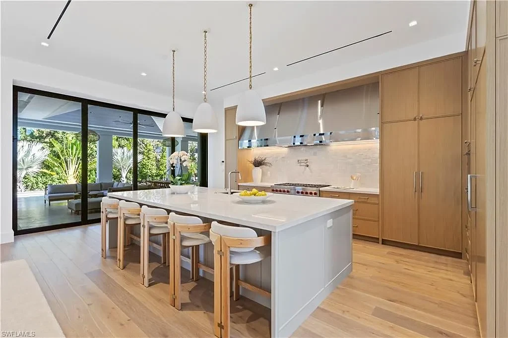 $12.5 Million Spectacular New Coastal Estate Debuts in Naples Real Estate Near Gulf Beaches 8 745 Pectin RD luxury home in Naples Florida featuring modern coastal architecture, resort-style pool and outdoor kitchen in Coquina Sands.