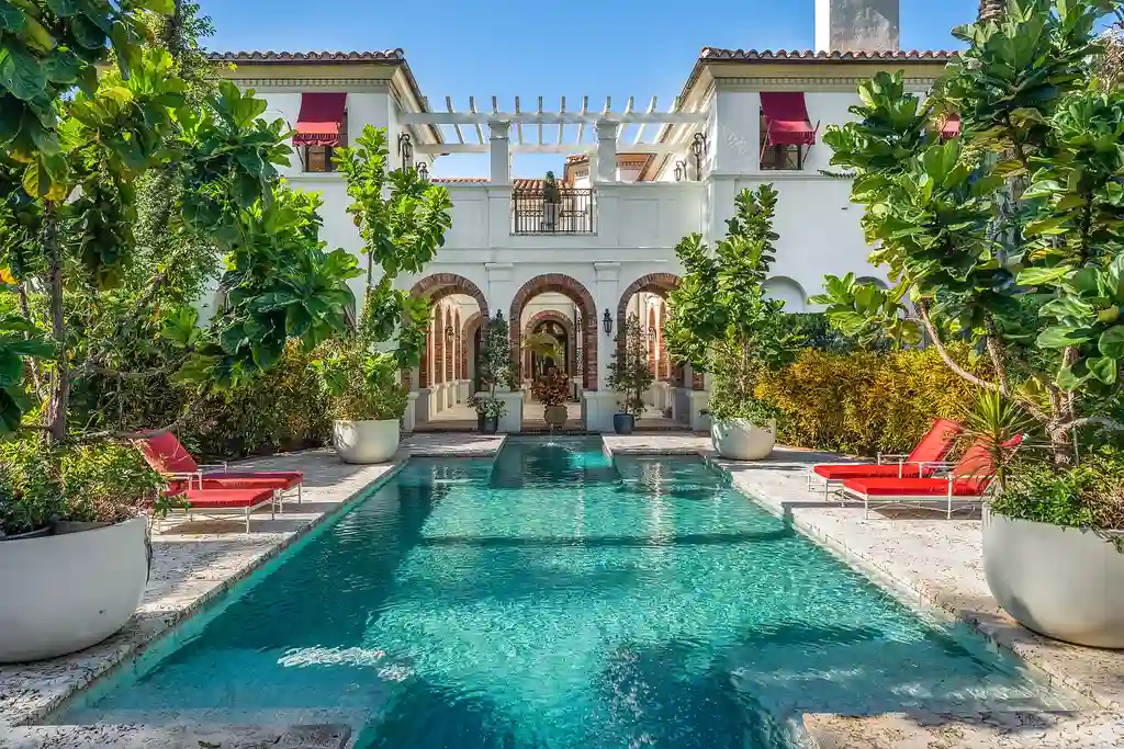 A $75 Million Private Peninsula Estate Sets a New Standard for Waterfront Living in Coral Gables 6 Tuscan-inspired waterfront estate at 9401 Journeys End Rd in Coral Gables featuring private peninsula, yacht dockage, luxury pool, and resort-style outdoor living