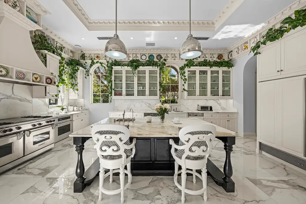 A $75 Million Private Peninsula Estate Sets a New Standard for Waterfront Living in Coral Gables 10 Tuscan-inspired waterfront estate at 9401 Journeys End Rd in Coral Gables featuring private peninsula, yacht dockage, luxury pool, and resort-style outdoor living