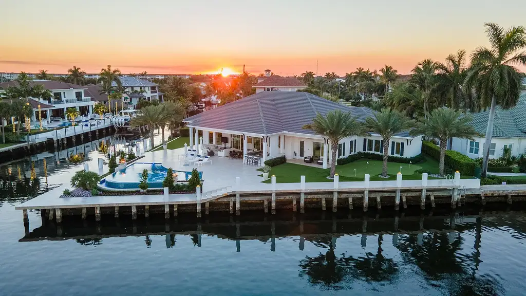 Stunning $10.5 Million British West Indies Waterfront Estate Hits the Market in Delray Beach 5 976 Cypress Drive luxury waterfront estate exterior view in Delray Beach with British West Indies architecture