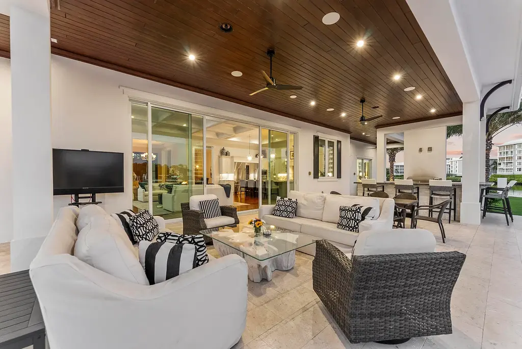 Stunning $10.5 Million British West Indies Waterfront Estate Hits the Market in Delray Beach 16 976 Cypress Drive luxury waterfront estate exterior view in Delray Beach with British West Indies architecture