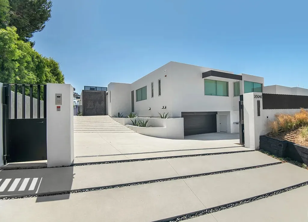 Most Expensive Homes in Malibu: 10 Trophy Listings Redefining Pricing Power 14 modern Malibu home exterior with gated driveway and minimalist architecture