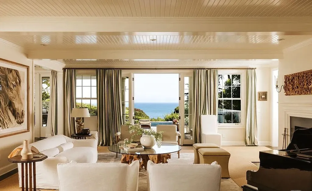 Most Expensive Homes in Malibu: 10 Trophy Listings Redefining Pricing Power 21 classic Malibu living room with fireplace and ocean view at 6825 Zumirez Drive