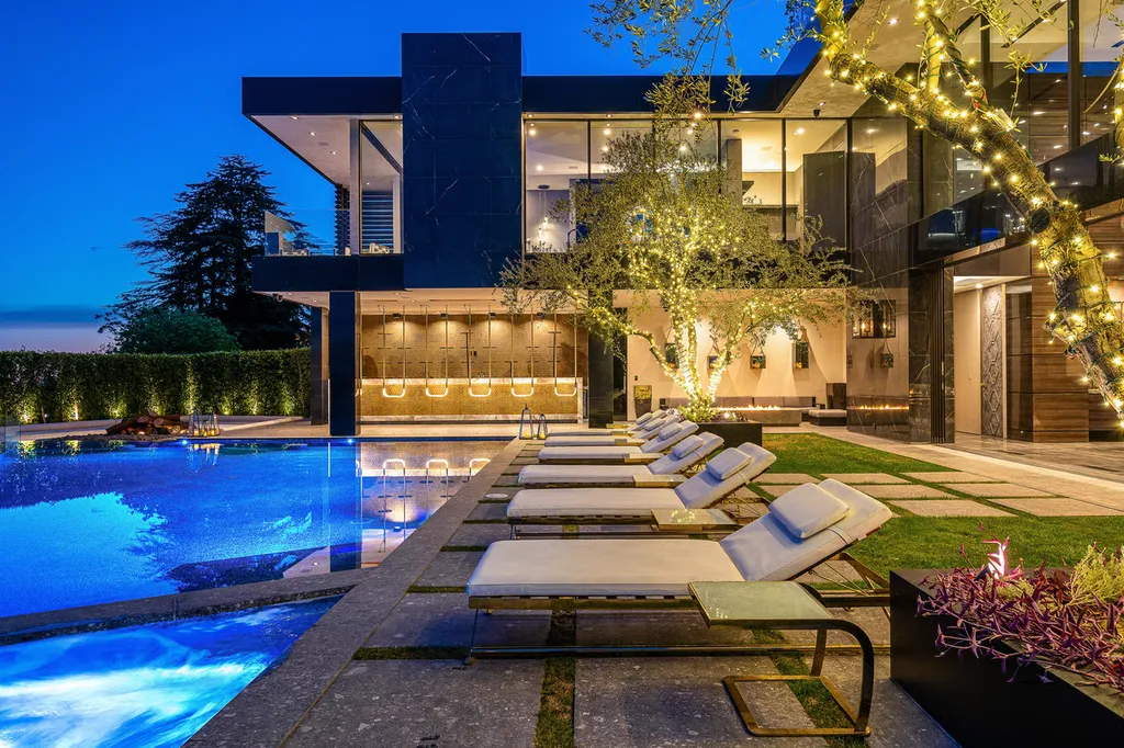 Most Expensive Homes in Los Angeles 17 luxury bel air mega mansion with illuminated pool and outdoor lounge at night los angeles