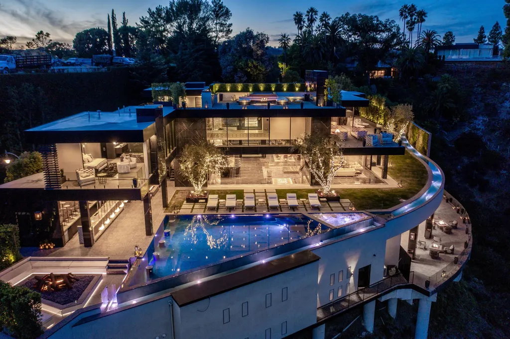 Most Expensive Homes in Los Angeles 18 aerial night view of bel air mega mansion with infinity pool and multi level terraces los angeles
