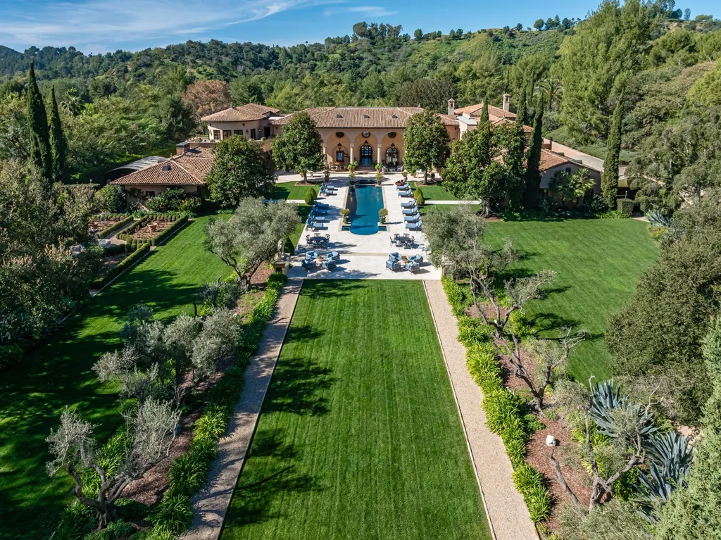 A $68,000,000 Beverly Park Estate Signals a New Era of Ultra-Scale Luxury in Los Angeles 2 Aerial view of a luxury estate in Beverly Park Los Angeles featuring expansive landscaped grounds, long driveway, and private hillside surroundings