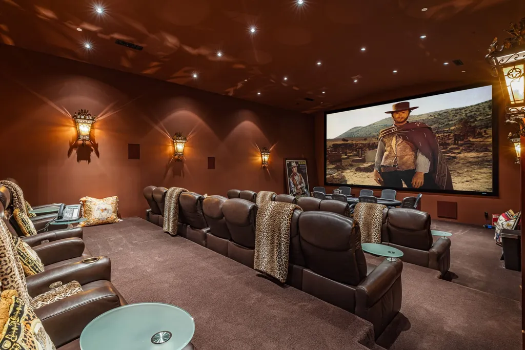A $68,000,000 Beverly Park Estate Signals a New Era of Ultra-Scale Luxury in Los Angeles 9 Private home theater inside a Beverly Park estate in Los Angeles featuring reclining seats, large projection screen, and luxury cinema design