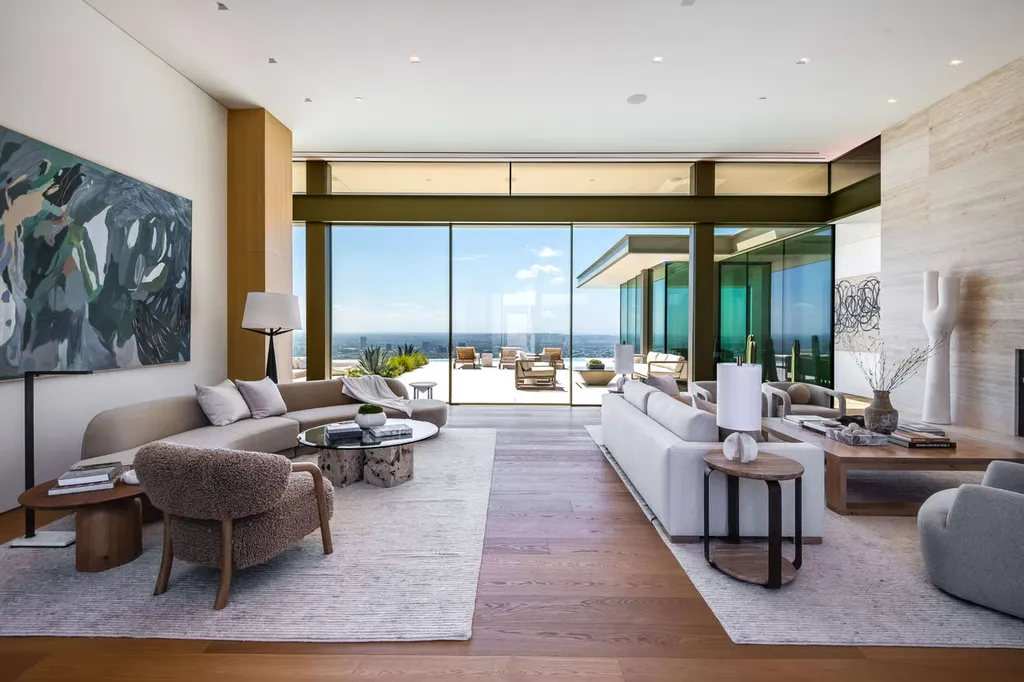 Most Expensive Homes in Los Angeles 12 modern living room with glass walls overlooking los angeles skyline bird streets luxury home