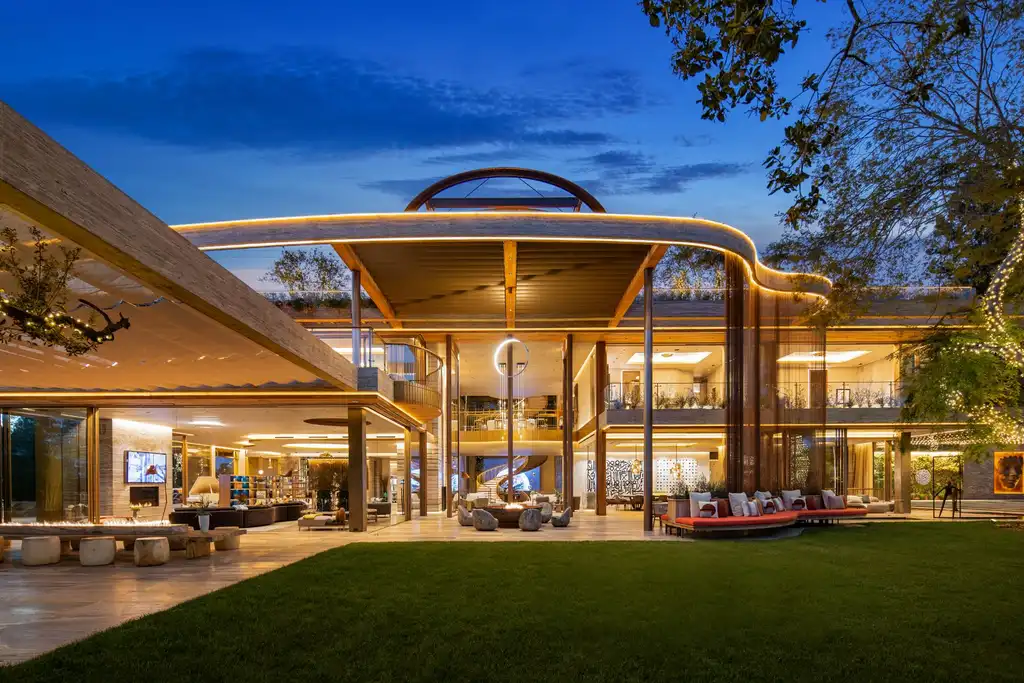 Most Expensive Homes in California 7 607 Siena Way Bel Air modern mansion illuminated at night with open glass architecture