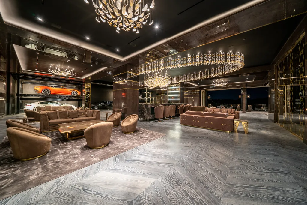 Most Expensive Homes in California 21 luxury entertainment space with chandelier lighting and car display inside Bel Air mansion