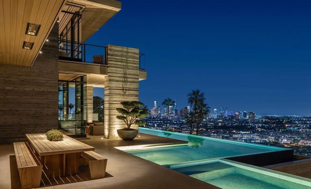 Most Expensive Homes in California 10 infinity pool overlooking Los Angeles skyline at night from Hollywood Hills mansion