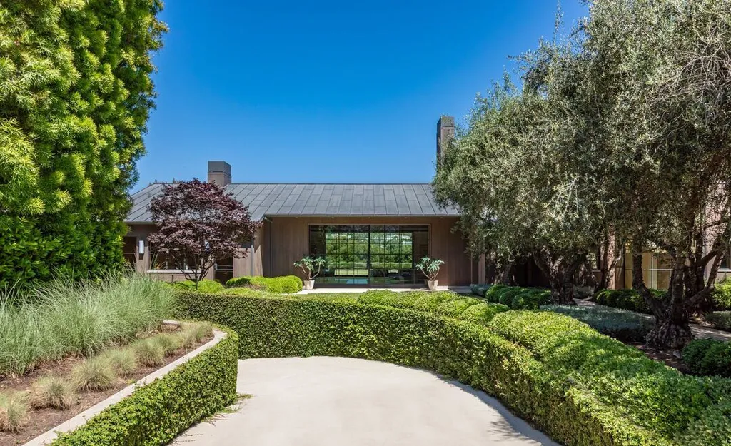 Most Expensive Homes in California 35 landscaped garden with curved pathways and mature trees at Santa Monica estate
