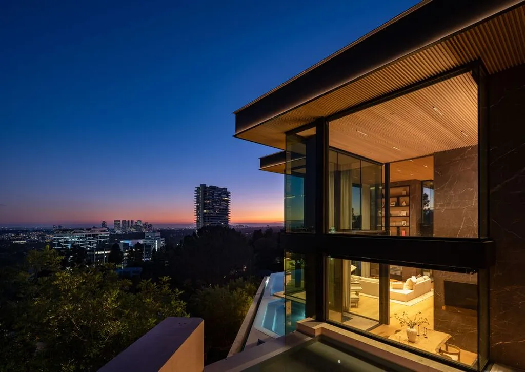 Most Expensive Homes in California 37 modern hillside mansion at sunset with glass walls and illuminated interiors