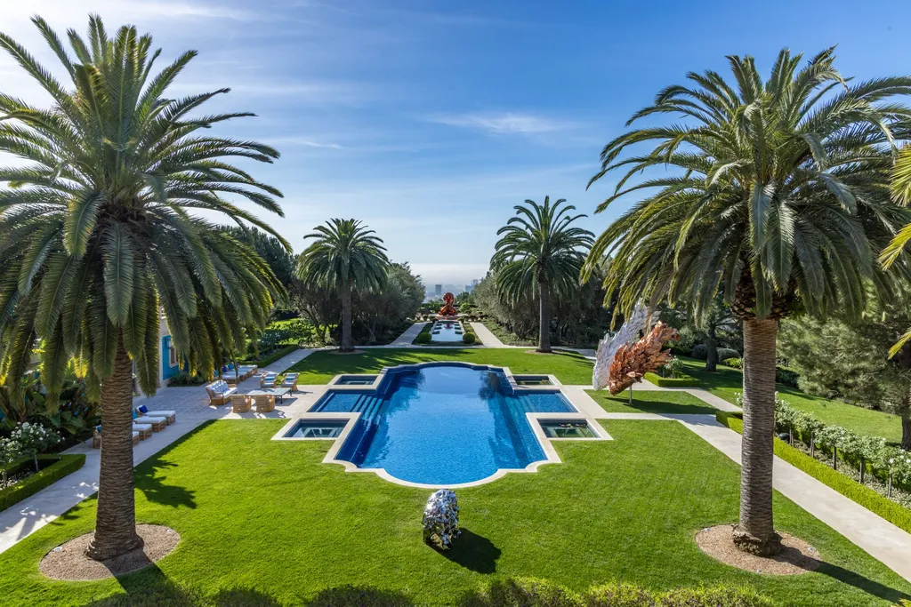 A Bel Air Estate That Redefines the Upper Limits of Global Luxury 9 formal garden and pool at Chalon Road estate in Bel Air with symmetrical layout and panoramic Los Angeles backdrop
