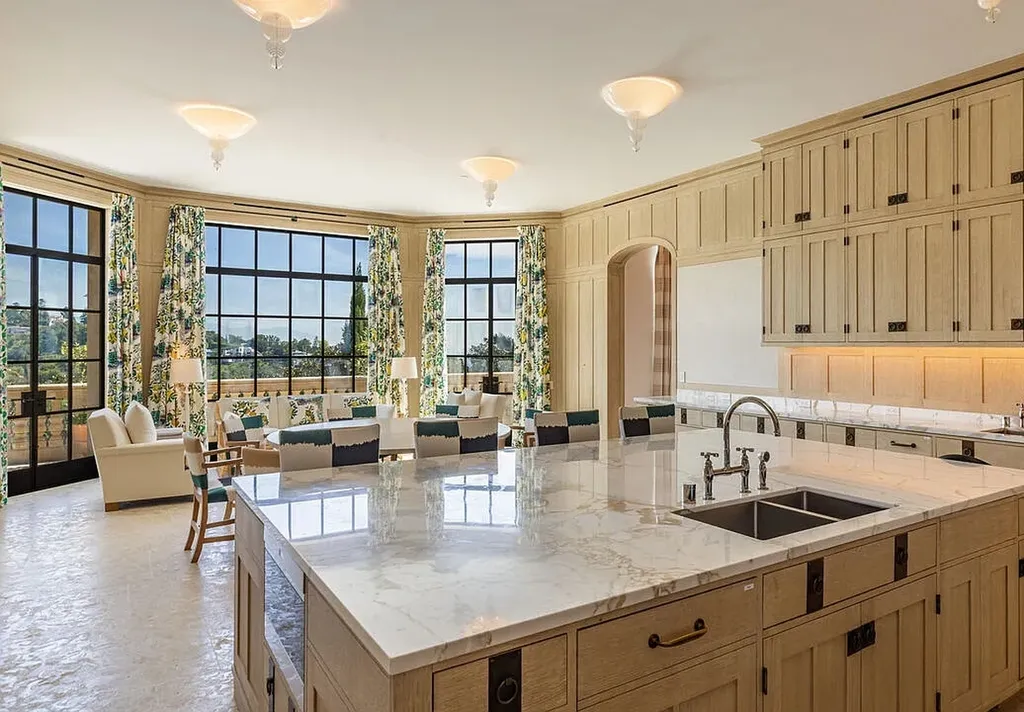 A Bel Air Estate That Redefines the Upper Limits of Global Luxury 6 luxury kitchen at Chalon Road estate in Bel Air with marble island and open lounge area overlooking Los Angeles views