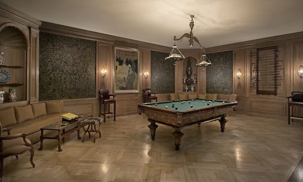 Chartwell Estate: One of the Most Iconic Estates in Bel Air Los Angeles 11 Billiards room at Chartwell Estate with wood paneling and classic game table in Bel Air Los Angeles