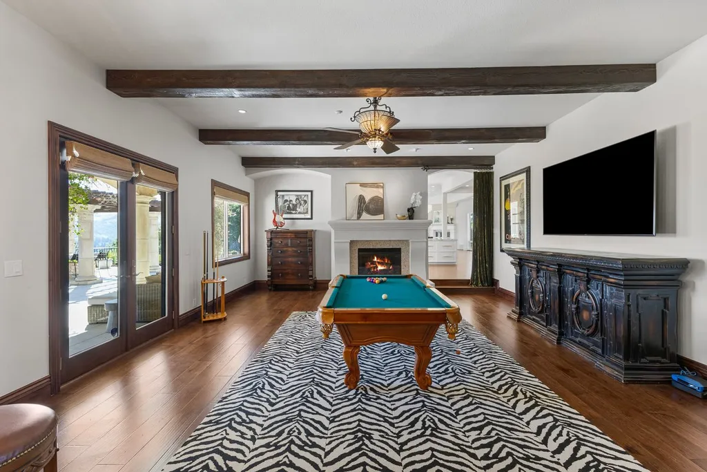 A Hilltop Estate in Danville That Defines a Different Kind of Luxury 12 billiard room inside Danville luxury estate with fireplace and outdoor access