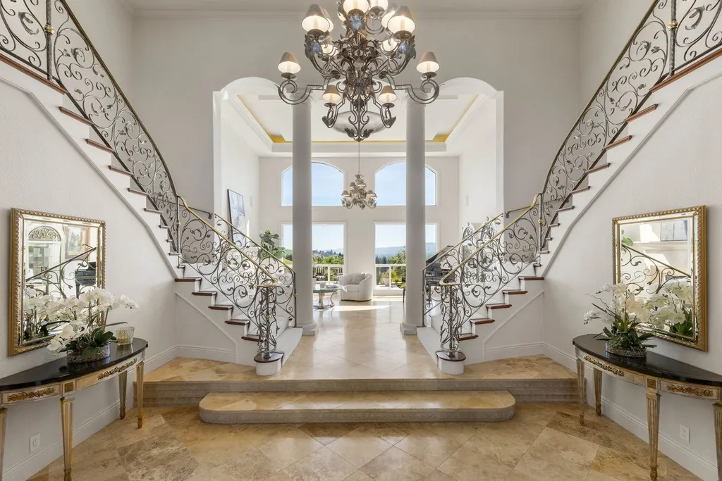 A Hilltop Estate in Danville That Defines a Different Kind of Luxury 4 grand foyer interior with dual staircase and chandelier in luxury estate in Danville California