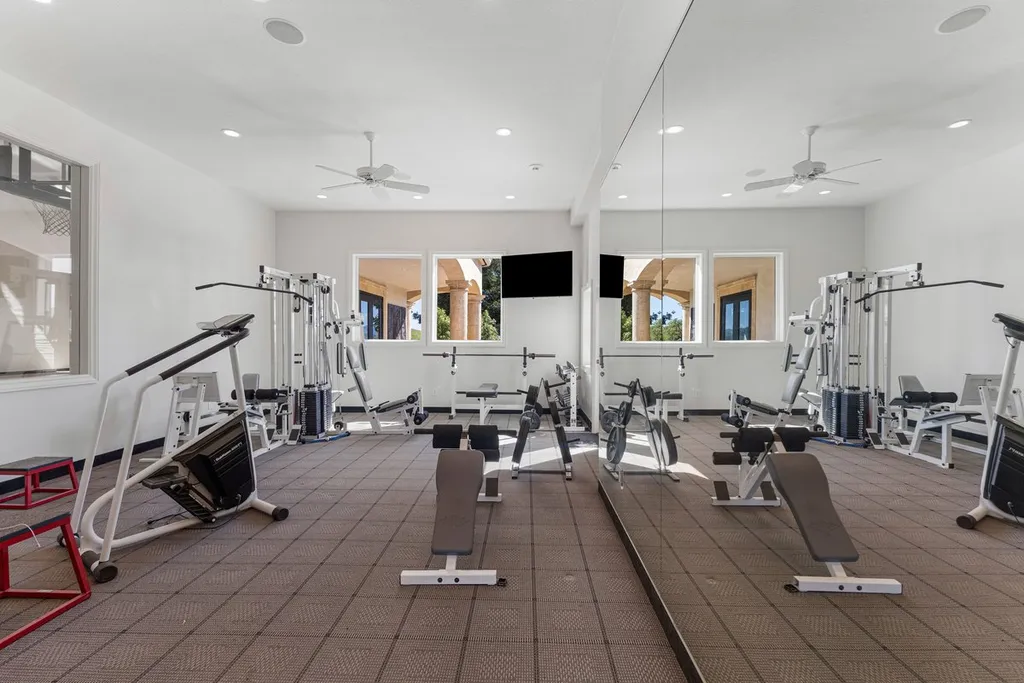 A Hilltop Estate in Danville That Defines a Different Kind of Luxury 10 private home gym in Danville luxury estate with fitness equipment and mirrored walls