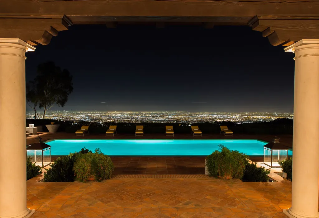 Hacienda de la Paz: One of the Largest Private Estates in California 3 Hacienda de la Paz infinity pool overlooking Los Angeles city lights at night from Rolling Hills estate