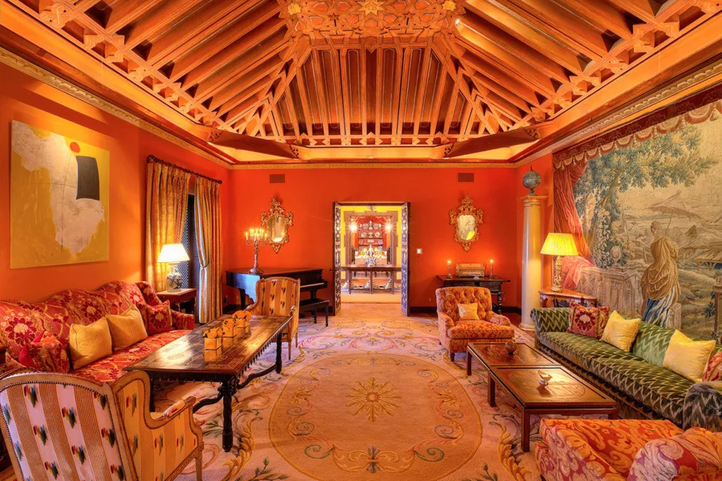 Hacienda de la Paz: One of the Largest Private Estates in California 5 Hacienda de la Paz living room with Spanish design elements carved wood ceiling and vibrant interior details