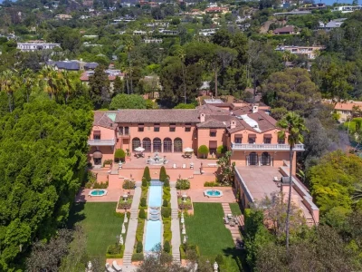 The Hearst Estate in Beverly Hills: A Historic Landmark Where Hollywood Legacy Meets Market Reality 3 The Hearst Estate in Beverly Hills with grand entrance long private driveway and historic mansion architecture