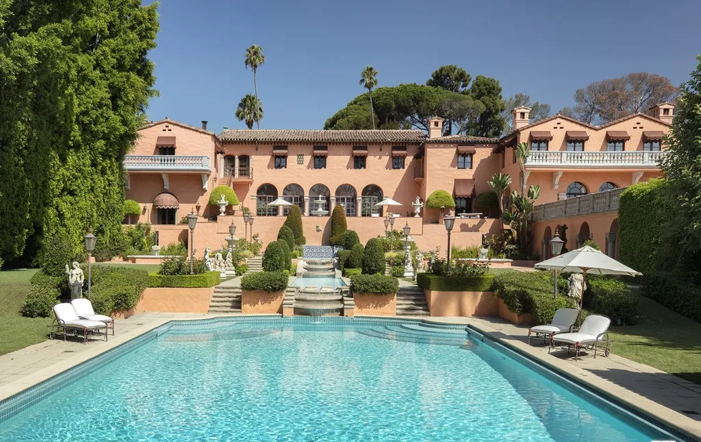 The Hearst Estate in Beverly Hills: A Historic Landmark Where Hollywood Legacy Meets Market Reality 14 The Hearst Estate in Beverly Hills featuring swimming pool with terraced gardens, fountains, and Mediterranean style architecture