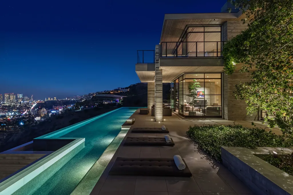 Most Expensive Homes in Los Angeles 20 modern concrete mansion with infinity edge pool overlooking los angeles skyline at night hollywood hills
