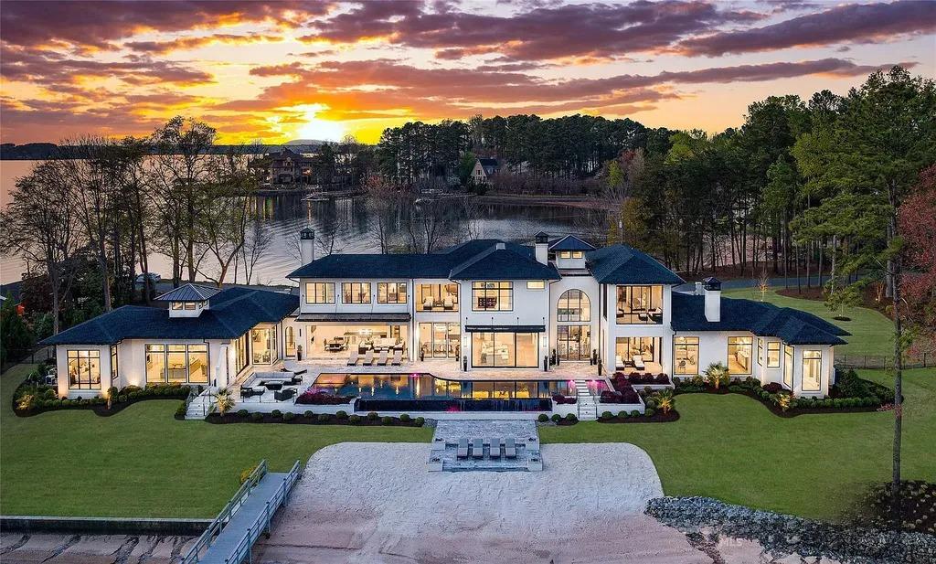 Lake Norman Estate Blends Architectural Precision With Private Waterfront Living 1 modern lakefront luxury home at sunset in Cornelius North Carolina overlooking Lake Norman with infinity pool