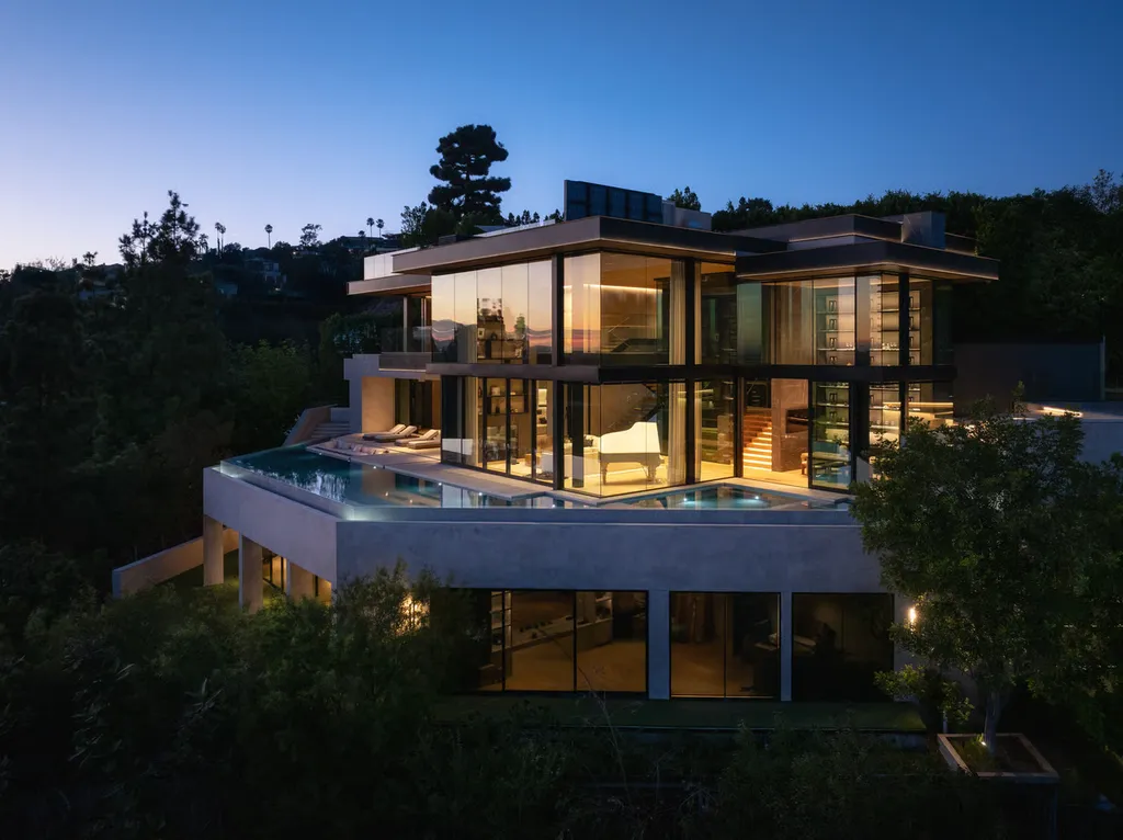 Most Expensive Homes in Los Angeles 15 modern glass mansion at night in los angeles with infinity pool and illuminated architecture