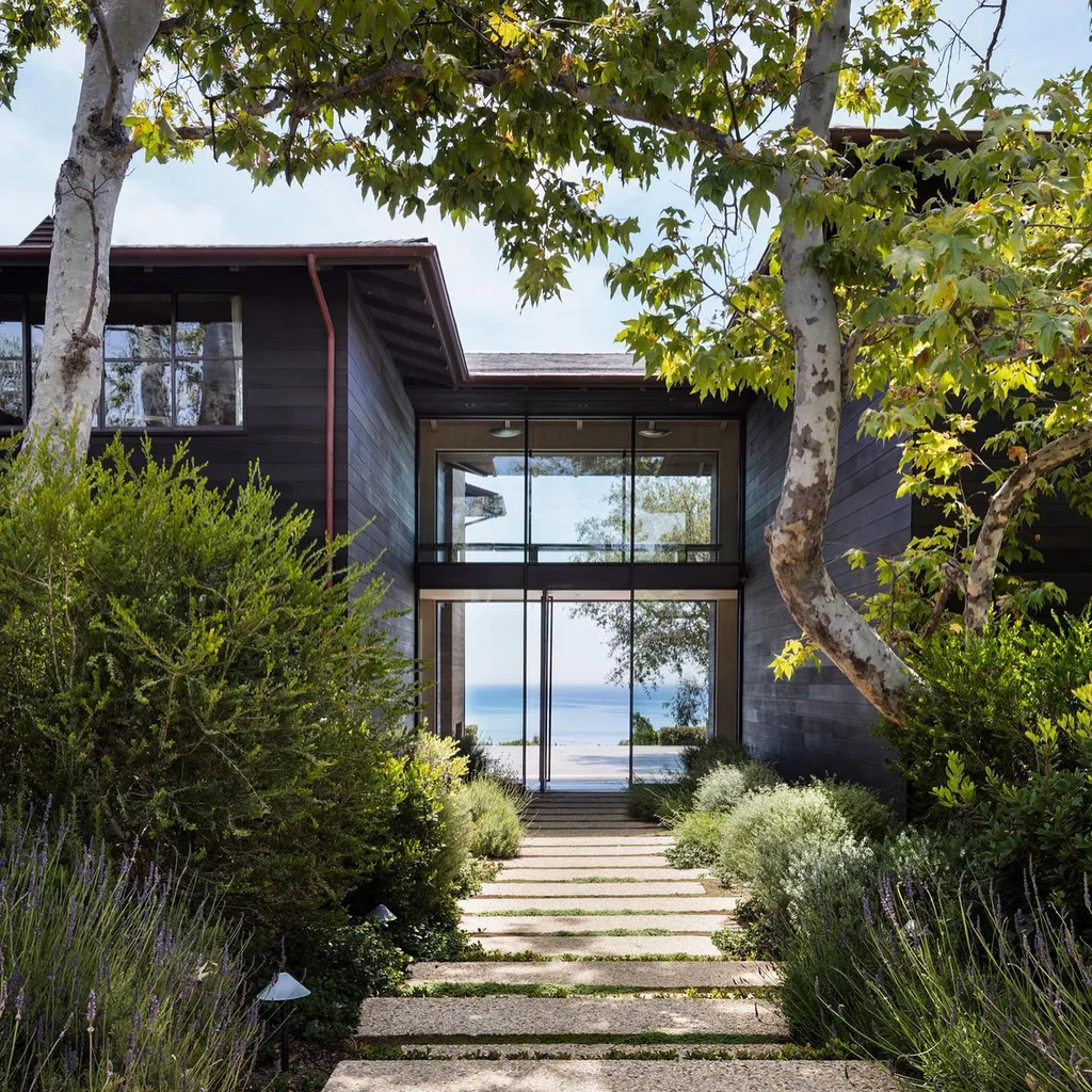 Most Expensive Homes Ever Sold in California 10 Entrance pathway leading to Malibu estate with ocean view framed by landscaping