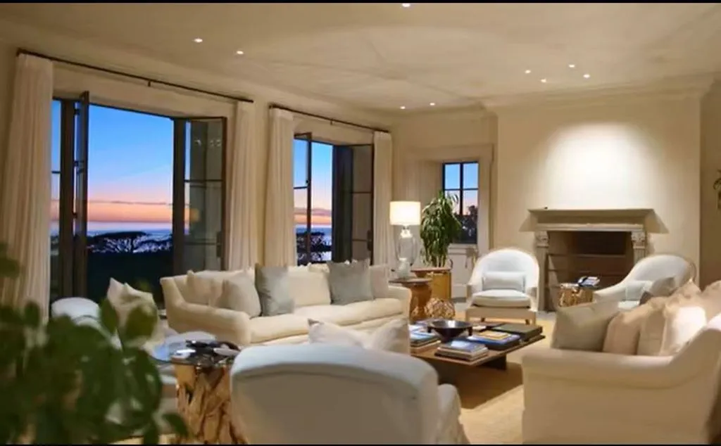 Most Expensive Homes Ever Sold in California 3 Luxury living room in Malibu oceanfront estate with panoramic Pacific Ocean sunset views