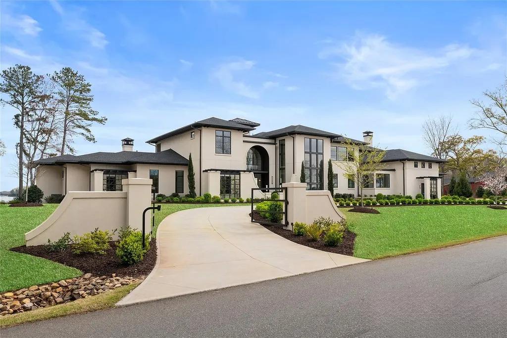 Lake Norman Estate Blends Architectural Precision With Private Waterfront Living 2 modern luxury home exterior with curved driveway and gated entrance in Cornelius North Carolina near Lake Norman