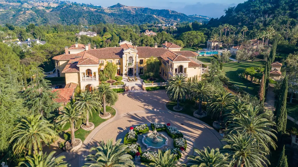 Villa Firenze: One of the Largest Private Estates in Beverly Hills 2 aerial view of Villa Firenze estate in Beverly Hills showing courtyard palm trees and expansive grounds