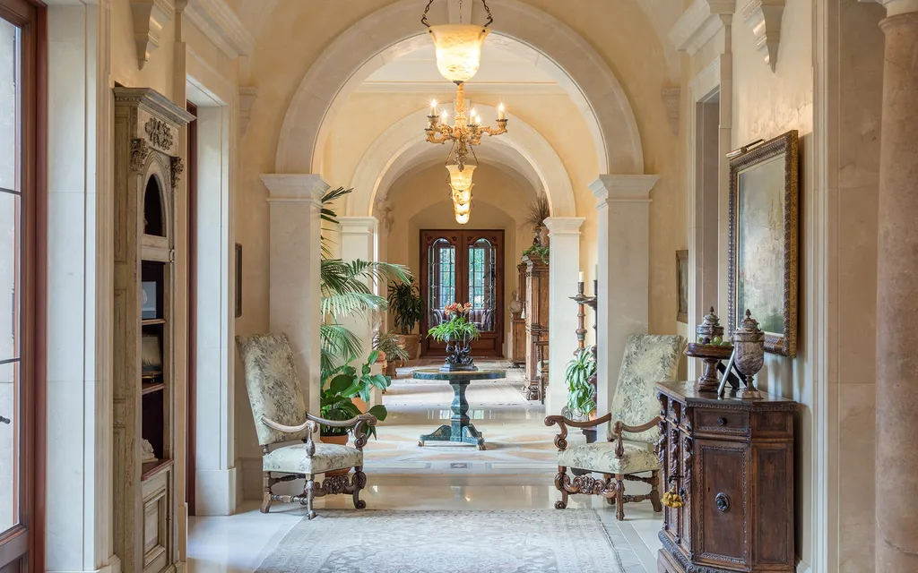 Villa Firenze: One of the Largest Private Estates in Beverly Hills 5 arched hallway inside Villa Firenze Beverly Hills with columns chandeliers and classical interior details
