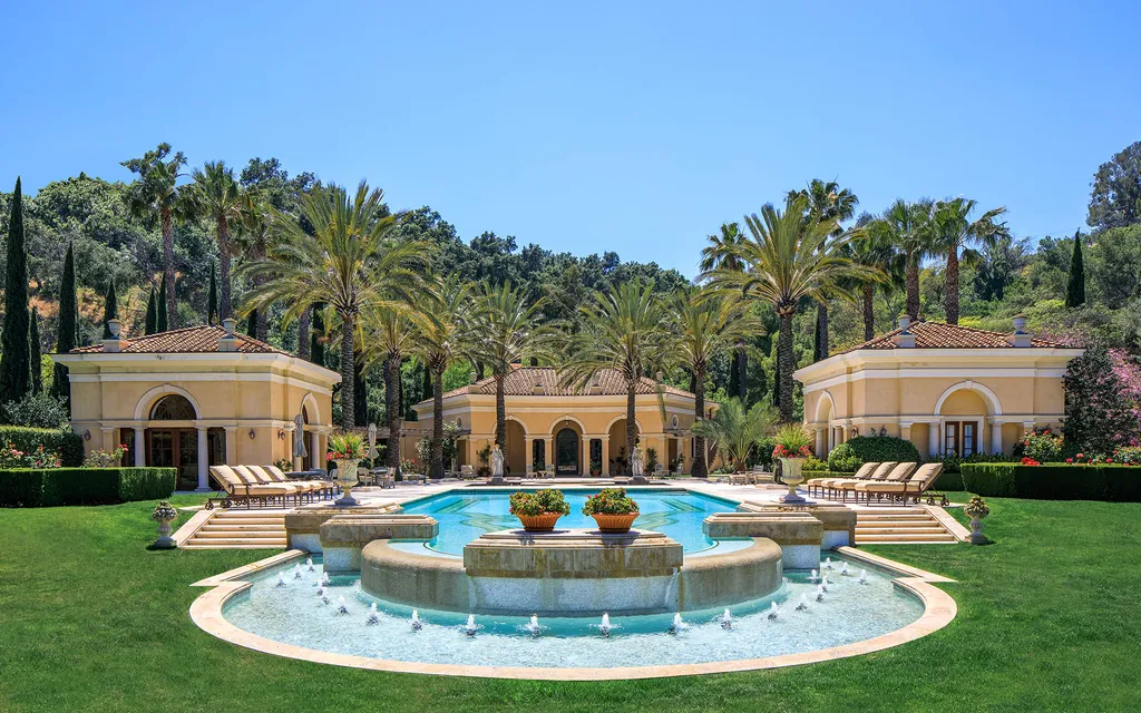 Villa Firenze: One of the Largest Private Estates in Beverly Hills 11 grand fountain courtyard at Villa Firenze Beverly Hills with pool pavilions and Canary Island palm trees