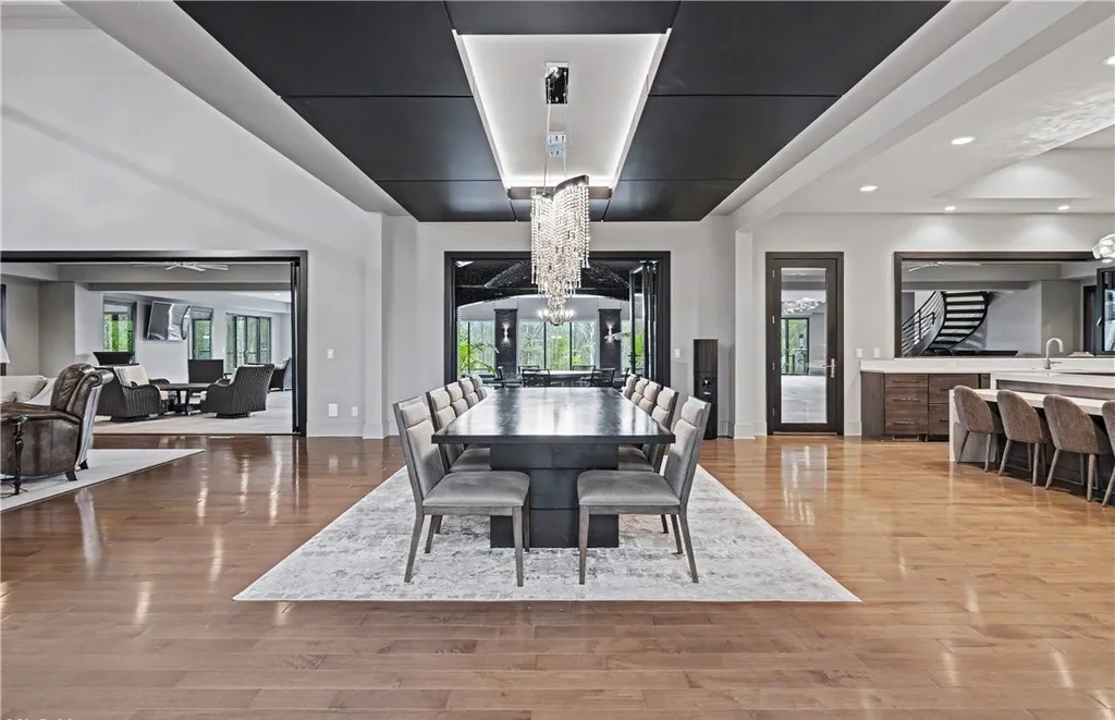 An Award Winning Modern Wellness Estate in Ohio Lists for $10,900,000 as a Private Resort Inspired Sanctuary 9 Contemporary formal dining room with designer chandelier at 1433 Ridgemont Trl in Hinckley Ohio