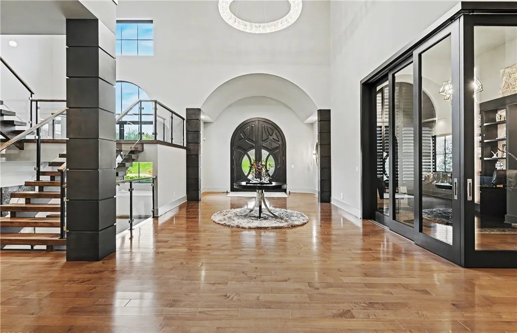 An Award Winning Modern Wellness Estate in Ohio Lists for $10,900,000 as a Private Resort Inspired Sanctuary 3 Modern foyer with floating staircase and dramatic entry hall at 1433 Ridgemont Trl in Hinckley Ohio