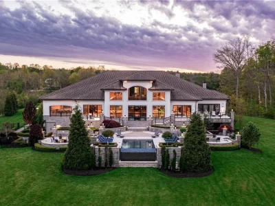 An Award Winning Modern Wellness Estate in Ohio Lists for $10,900,000 as a Private Resort Inspired Sanctuary 1 Rear exterior view of the modern luxury estate with infinity pool at 1433 Ridgemont Trl in Hinckley Ohio