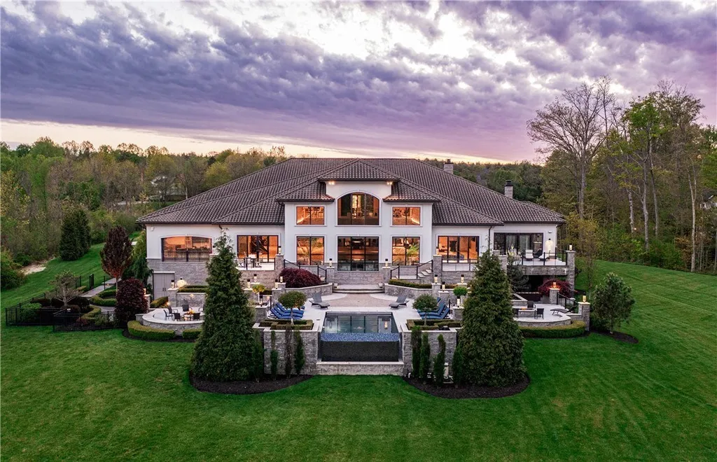 An Award Winning Modern Wellness Estate in Ohio Lists for $10,900,000 as a Private Resort Inspired Sanctuary 2 Rear exterior view of the modern luxury estate with infinity pool at 1433 Ridgemont Trl in Hinckley Ohio