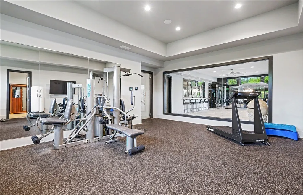 An Award Winning Modern Wellness Estate in Ohio Lists for $10,900,000 as a Private Resort Inspired Sanctuary 10 Private fitness studio with modern gym equipment at 1433 Ridgemont Trl in Hinckley Ohio