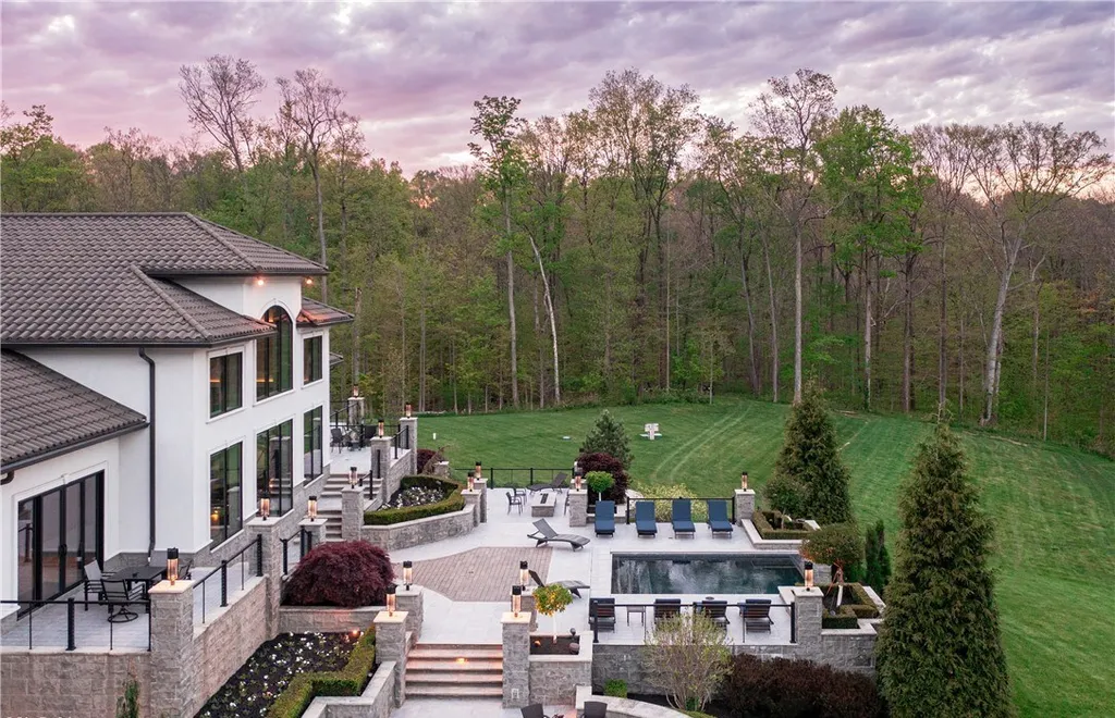 An Award Winning Modern Wellness Estate in Ohio Lists for $10,900,000 as a Private Resort Inspired Sanctuary 12 Resort style infinity edge pool and outdoor terraces at 1433 Ridgemont Trl in Hinckley Ohio