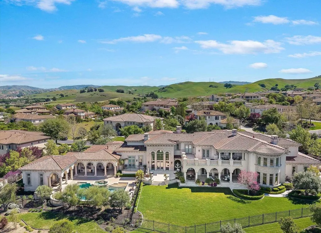 Inside a $13.5 Million Mediterranean Mansion in Ruby Hill, Pleasanton 14 Aerial view of 1515 Germano Way in Pleasanton showcasing the Mediterranean estate, expansive lawn, pool pavilion, and surrounding rolling hills.