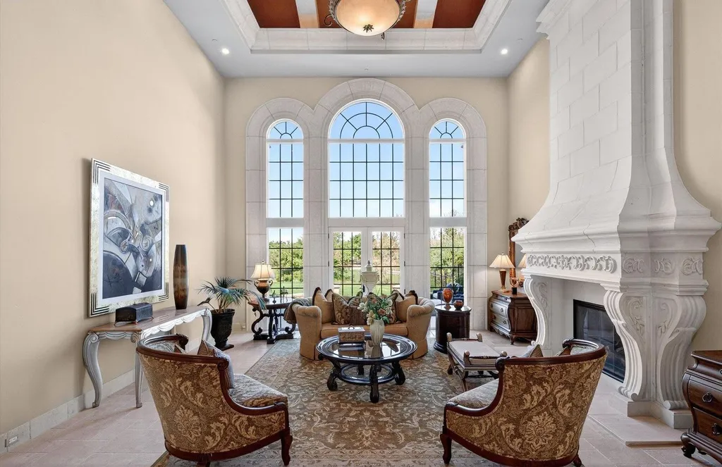 Inside a $13.5 Million Mediterranean Mansion in Ruby Hill, Pleasanton 4 Formal living room inside the Mediterranean estate at 1515 Germano Way featuring soaring arched windows, ornate fireplace, and elegant traditional interiors.