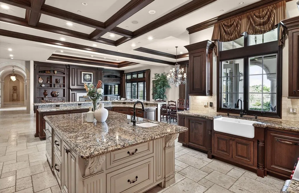 Inside a $13.5 Million Mediterranean Mansion in Ruby Hill, Pleasanton 6 Luxury gourmet kitchen at 1515 Germano Way featuring dual granite islands, custom wood cabinetry, coffered ceilings, and high-end appliances.